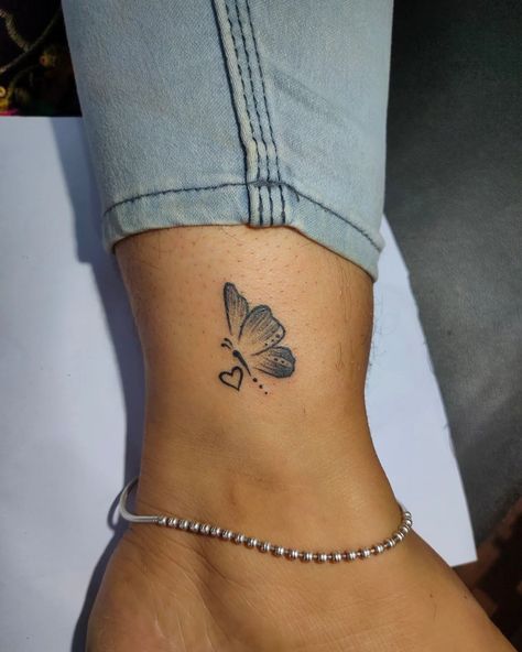 Small Heart And Butterfly Tattoo, Infinity Butterfly Tattoo For Women, Butterfly Tattoo With Heart, Butterfly With Heart Tattoo, Cross With Butterfly Tattoo, Cross Butterfly Tattoo, Heart And Butterfly Tattoo, Below Collar Bone Tattoo, Butterfly And Heart Tattoo