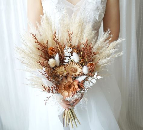 PRICES MAY VARY. dried flowers, wedding bouquet,dried flower bouquet,rustic wedding,wedding decor,wedding flowers,bridal bouquet,bridesmaids flowers, This pretty bouquet is accented with gorgeous dried flowers, preserved flowers and silk flowers. It is perfect for an outdoor or woodland-themed wedding. It could be used on the weddings,and also could be used as home decoration,even as a gift for the bridesmaid. Very useful. Size: made to order Natural Wedding Flowers, Wedding Dress Topper, Grass Bouquet, Pampas Grass Bouquet, Boho Wedding Bouquet, Prettiest Bouquet, Grass Wedding, Dry Flower, Orange Wedding