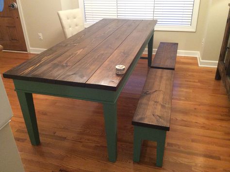 Finished farm table.  Pine top distressed and burned, finished with Minwax Dark Walnut stain.  Benjamin Moore Webster green skirt/legs.  Matching "5 board" benches.  Daddy Van's Wax for finish.  BM Webster Green bottom. Emerald Green Kitchen Table, Desk Colors, Dark Green Table, Walnut Kitchen Table, Farmhouse Style Kitchen Table, Farmhouse Style Kitchen Decor, Farmhouse Dining Room Table, Walnut Kitchen, Stained Table