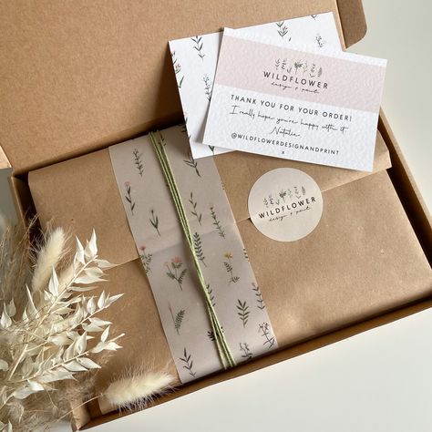 Small business packaging using Kraft paper, wildflower printed vellum, sage twine and branded sticker. Baby Footprint Kit, Etsy Packaging, Desain Tote Bag, Personalized Wreaths, Soya Mumu, Keepsake Baby Gifts, Baby Footprint, Clothing Packaging, Packaging Ideas Business