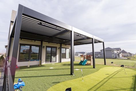 Check out this awesome transformation! We brought in a beautiful multi-zone pergola, heaters, artificial turf, and a putting green to make this backyard a space for the whole family to enjoy 🤩 Are you ready to make more memories outdoors this summer? Aluminum Pergola, Backyard Spaces, Artificial Turf, Roof Design, Pet Safe, Animals For Kids, The Whole, This Summer, Outdoor Living