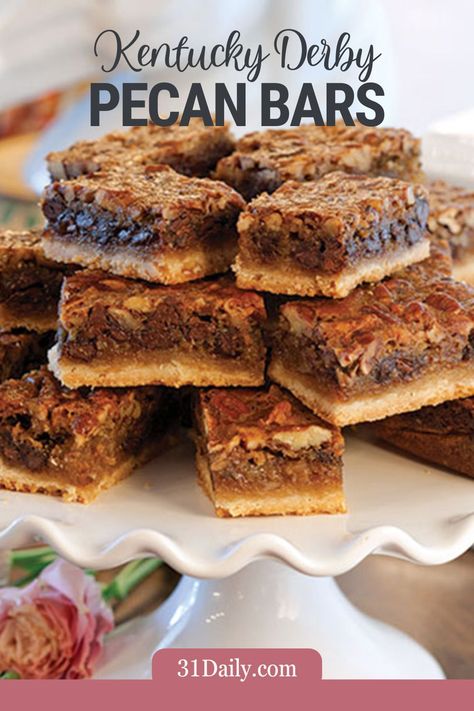 Celebrate the Kentucky Derby with these easy and delicious Kentucky Derby Bars. Much like Derby Pie, these bars are packed with traditional elements like butter, eggs, pecans, and chocolate! Derby Bars, Deserts For Kentucky Derby, Derby Bars Paula Deen, Kentucky Derby Cake Pops, Kentucky Derby Pecan Pie Bars, Kentucky Derby Pie With Bourbon, Derby Pie Bars, Kentucky Derby Cake, Kentucky Derby Desserts