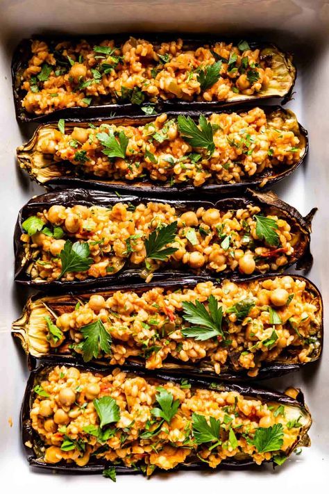 Mediterranean Inspired Vegetarian Stuffed Eggplant Recipe - Roasted eggplant halves filled with bulgur pilaf and drizzled with tahini yogurt sauce. #vegetarian #eggplant #stuffedeggplant Vegan Eggplant Recipes, Bulgur Recipes, Easy Mediterranean Recipes, Lemon Quinoa, Vegan Eggplant, Stuffed Eggplant, Eggplant Dishes, Eggplant Recipes, Banana Bread Recipes