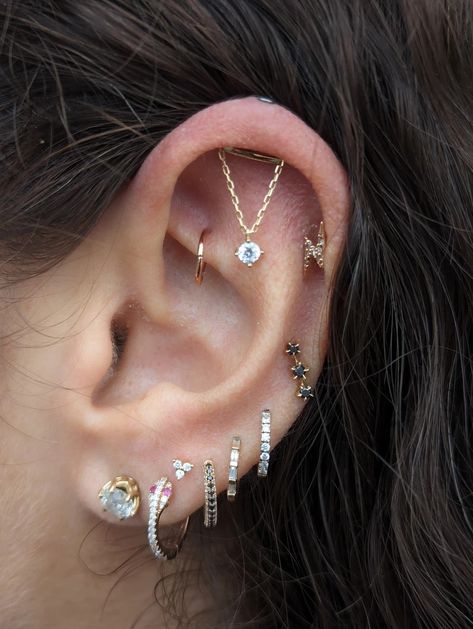 Elegant Complexity: Curated Ear with Vertical Helix Chain, Lobe Rings, and Rook Seam Ring | Gallery Chain Cartilage Earrings, Reverse Helix Piercing, Vertical Helix Piercing Jewelry, Lobes Piercing, Floating Helix Piercing, Hole Ear Piercing, Vertical Helix Piercing, Hidden Helix Piercing, Stacked Lobe Piercing