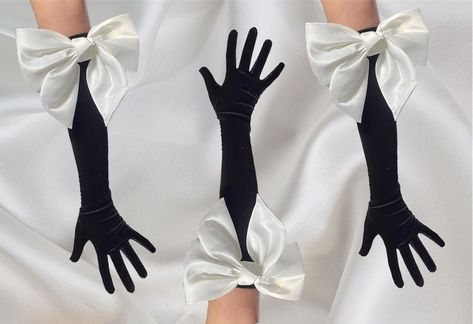 "White 3D bow on black velvet gloves, satin bow long glove, opera length statement gloves, Hollywood style party wedding drag glamorous  Perfect gift U.K. 1st class signed for postage Signed/ tracked and signed international shipping Simple and classy I have other beautiful gloves on my shop Please note: the ring is not included, this is just to show you that you can wear jewellery over the top These are a one size fits most, please check measurements in the photos. Please note: we do NOT accept returns on gloves due to hygiene reasons - we post ASAP with 1st class postage, Royal Mail seem to be back to their normal service for most areas. If you need these for a specific date please purchase \"express\" postage at check out, this is for Special Next Day by Royal Mail. International orders