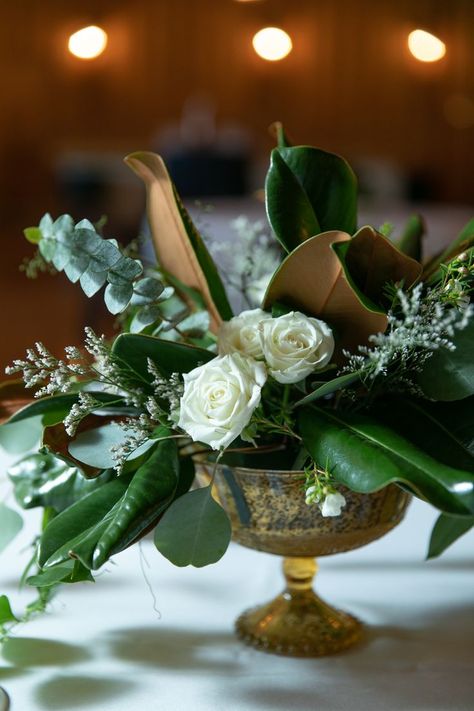 Magnolia Centerpiece Christmas, White Roses And Magnolia Leaves, Magnolia Branch Arrangement, Magnolia Centerpiece Wedding, Magnolia Table Decor, Magnolia Leaf Centerpiece, Magnolia Leaves Wedding, Magnolia Leaves Centerpiece, Magnolia Leaves Christmas