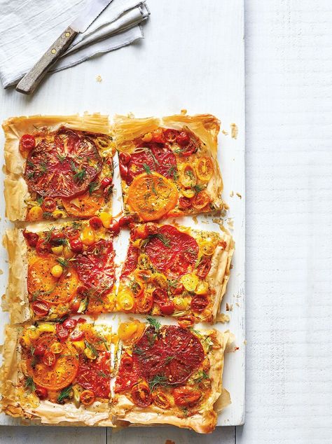 Cheesy Heirloom Tomato Tart — Real Simple Heirloom Tomato Tart, Tomato Tart Recipe, Puff Pastry Pizza, Southern Tomato Pie, Pastry Pizza, Spring Appetizers, Vegetarian Thanksgiving Recipes, Zucchini Tomato, Vegetarian Thanksgiving