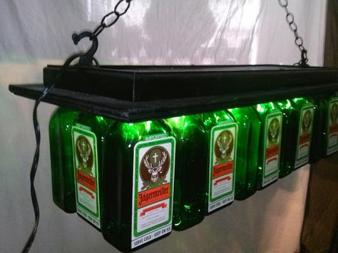 Related image Jagermeister Bottle Crafts, Beer Crafts, Table Chandelier, Bottle Chandelier, Liquor Bottle Crafts, Pool Table Lighting, Liquor Bottle, Glass Tumblers, Bottle Lamp