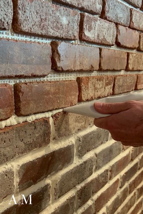 Bricks Backsplash Kitchen, Brick Floor Grout Color, Re Grouting Brick Fireplace, Grout Colors For Brick, Brick Veneer Accent Wall, Grouting Brick Backsplash, Brick In Bathroom Accent Walls, Bathrooms With Brick Walls, Brick Wall Exterior Ideas