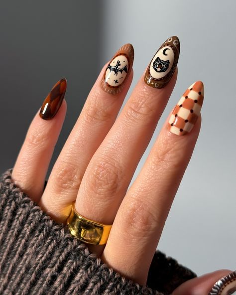 Recreated my favorite Vintage Halloween Nails I created last year! This time with a neutral, brown color scheme 😍 tutorial coming soon! • Products used: @ballpit_shop character creator collection #ballpitshop #gelnails #neutralgels #browngels #nailartist #gel #halloweennails #gelxnails #spookynails #vintagehalloween neutral vintage Halloween spooky nail art hand drawn Vintage Halloween Nail Art, Vintage Halloween Nails, Spooky Nail Art, Spooky Nail, Brown Color Schemes, Character Creator, Ball Pit, Halloween Nail Art, Vintage Theme