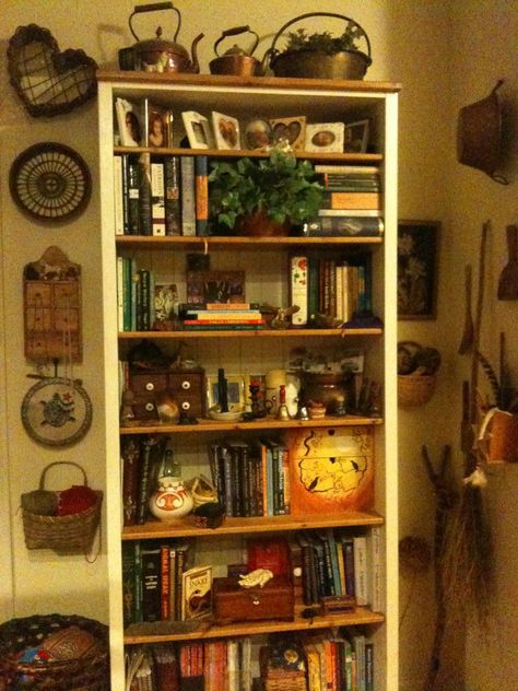 my witchy bookshelf Hippy Bookshelf, Bookshelf Altar Ideas, Cluttered Bookshelf Aesthetic, Whimsigoth Bookshelf, Old Bookshelf Aesthetic, Bookshelf Reference, Bookshelf Altar, Maximalist Bookshelf, Home Library Design Bookshelves