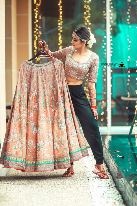 Latest bridal lehenga photoshoot ideas for the Indian brides. Such trending bridal poses are the inspiration for this wedding season.#indianbride #bride #bridalposes  #weddingsonly #weddingsonlybrides #bridetobe #indianwedding #wedding #weddingphotgraphy #bridallehenga #lehengashootideas #bridalphotoshoot #weddingshoot #indianweddinginspiration #bridaljewellery #bridaloutfit #trendingbridalposes #trendingbridalshoot #preweddingshoot #weddingshoot #uniquelehenga Bridal Lehenga Photoshoot, Lehenga Photoshoot Ideas, Photoshoot Lehenga, Lehenga Photoshoot, Latest Dress Trends, Getting Ready Shots, Portraits Poses, Bridal Pose, Bridal Photography Poses