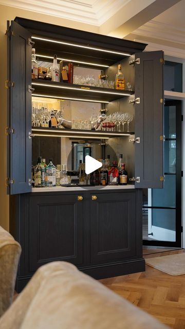 Daval Furniture on Instagram: "A hidden bar area in this luxury Oakley inframe kitchen in Charcoal makes for the ultimate entertaining space. Would you have a hidden bar area in your kitchen?  #kitchendesign #kitchenideas #kitchendesign #luxurykitchen #inframekitchen #luxuryhomes" Hidden Bar Cabinet, Inframe Kitchen, 2024 Family, Hidden Bar, Entertaining Space, Drinks Cabinet, Bar Area, Bar Areas, Bar Cabinet