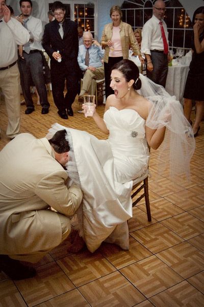 AHH! The garter toss! Had no idea the history behind it was SO creepy! Eeek! Reception Itinerary, Garter Toss Songs, Garter Removal, Wedding Songs Reception, Wedding Garter Toss, Funny Wedding Photography, Candle Lighter, Song Ideas, Garter Toss