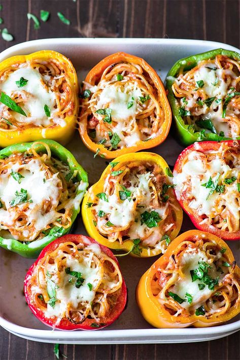 Cheesy Spaghetti Stuffed Peppers! Tender Italian stuffed peppers filled with spaghetti, ricotta, parmesan, and Ragu Homestyle Thick and Hearty Four Cheese Sauce. | HomemadeHooplah.com #AD #SimmeredinTradition Spaghetti Ricotta, Stuffed Pepper Recipes, Easy Stuffed Pepper Recipe, Italian Stuffed Peppers, Cheesy Spaghetti, Easy Stuffed Peppers, Pepper Recipes, Stuffed Pepper, Side Dishes For Bbq