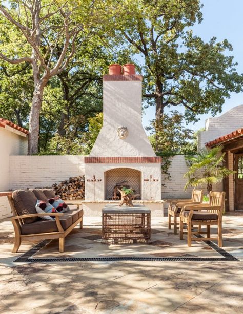 An outdoor fireplace is a great way to create ambiance for a patio living room. #patiolivingroom #patiodesignideas #patioideas #patiofireplace #mediterraneanpatio #patios Spanish Courtyard, Mediterranean Patio, Spanish Decor, Build A Fireplace, Spanish Villa, Plans Architecture, Spanish Style Home, Hacienda Style, Mediterranean Decor