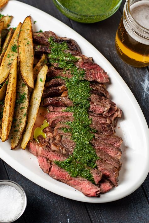 Steak frites recipe. Delicious pan-seared ribeye steak topped with homemade chimichurri sauce. Loaded with garlic, cilantro, and cumin, chimichurri will transform your sirloin steak into a Latin American dish and perfectly complement every bite. Served with crispy golden russet potato wedges seasoned with garlic powder, onion powder, paprika, salt, and pepper. It's the perfect blend of spices for fries. #steakfrites #steakandchimichurri #steak #chimichurri Steak And Fries Recipes, Steak Frites With Chimichurri, Steak Frites Recipe, Sous Vide Recipes Beef, Chimichurri Recipe Steak, Steak Chimichurri, Kitchen Swagger, Steak With Chimichurri, Steak With Chimichurri Sauce