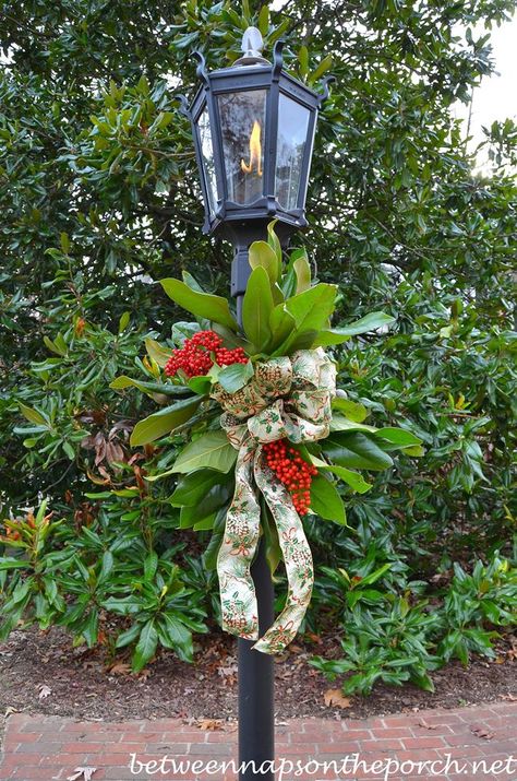 Decorate a Lantern for Christmas with Greenery from the Garden Decorating A Lantern For Christmas, Christmas Lights On Fence, Lights On Fence, Christmas Mailbox Decorations, Christmas Lamp Post, Mailbox Decor, Christmas Lamp, 12 December, Christmas Greenery