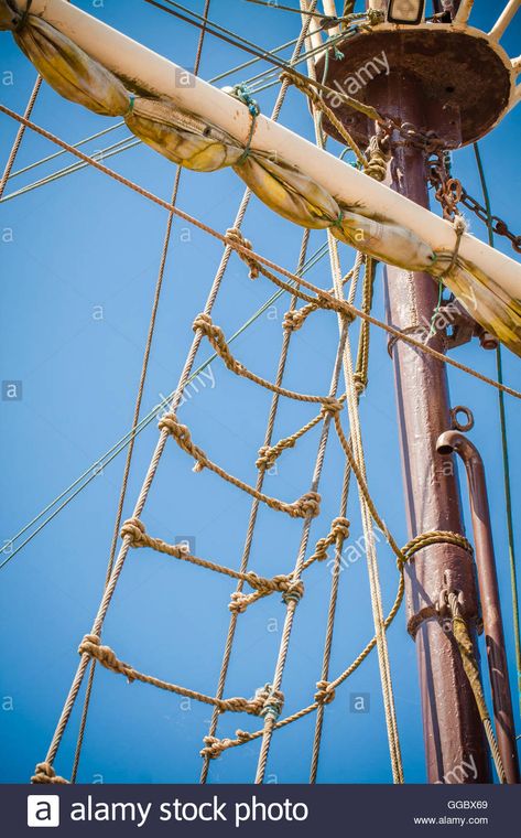 Download this stock image: The mast of old ship with sail and ladder made of rope. - GGBX69 from Alamy's library of millions of high resolution stock photos, illustrations and vectors./ Pirate Moodboard, Ship Rope, Ship Mast, Rope Drawing, Ocean Mural, Boat Ladder, Boat Rope, Old Ship, Pirate Decor