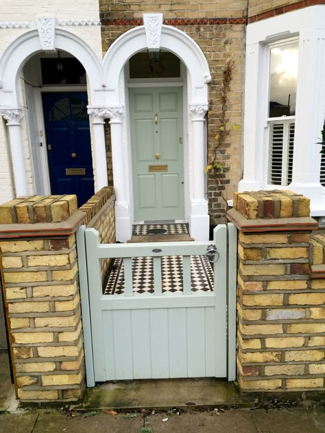 We styled this London Front Garden so that the yellow brick wall and painted front gate match the style of this period property. Victorian Terrace Front Garden, Small Garden Gates, Yellow Brick Houses, Victorian Front Garden, Terrace House Exterior, Wooden Garden Gate, London Brick, Garden Gate Design, Brick Houses