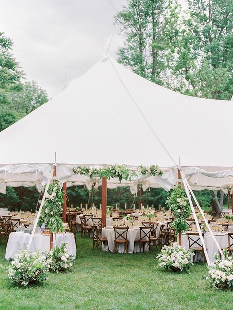 The reception took place under a sailcloth tent behind the house. Bistro lights were draped overhead and a floral arch and several potted arrangements welcomed guests at the entrance. Wedding Ceremony Under Tent, Tent Entrance Wedding, Wedding Tent Entrance, Pool Weddings, Tent Entrance, Tent Wedding Reception, June Bride, Wedding Backyard Reception, Backyard Reception