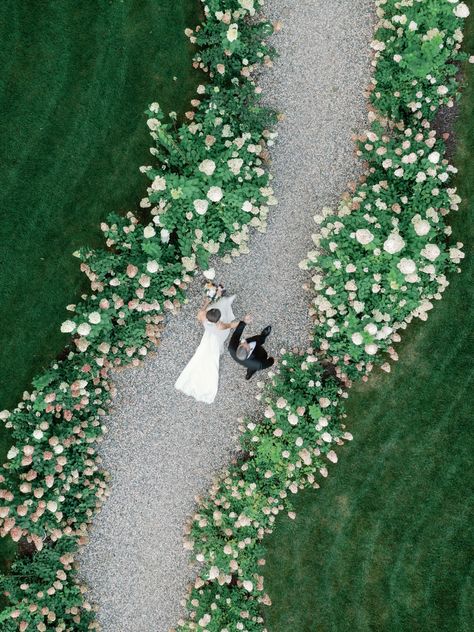 Drone view of newlyweds walking through english style gardens at Greencrest Manor in Battlecreek, Michigan.  European inspired wedding venue. Manor house weddings. Drone Wedding Photography, Greencrest Manor, Drone Wedding, European Inspired Wedding, Grand Rapids Wedding, House Weddings, Luxury Wedding Photography, Grand Rapids Michigan, Michigan Wedding Photographer