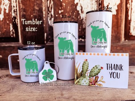 "A perfect way to say \"Thank You\" to your new Livestock Buyer! This 4-H gift set is a perfect way to show your appreciation to your new livestock buyer. This gift set includes personalized mug or tumbler, a \"Proud Livestock Buyer\" keychain and a Thank You card. This set will be cherished for years to come and will be the envy of other buyers. These dishwasher safe items come in different sizes: Tumbler: 12 oz, 22 oz OR 30 oz Double sided metal \"Proud Livestock Buyer\" keychain with a cable. 4h Gift Ideas, Buyer Gifts For Fair, Buyers Baskets 4-h, Buyer Basket Ideas For 4h, 4h Buyer Thank You Gift Ideas, Buyers Letters For Fair For 4h, 4h Livestock Pen Decorations, 4h Buyers Letters Ideas, Ffa Thank You Gifts