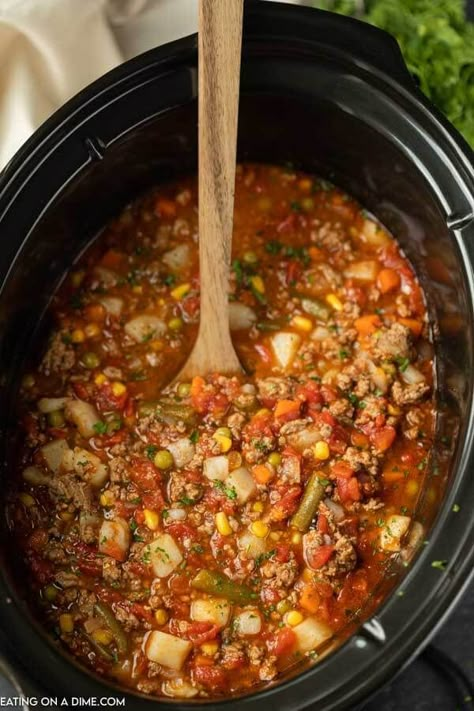 Try this tasty Crock Pot Vegetable Beef Soup Recipe! This soup is crazy easy because there isn't much chopping involved. Just toss and go! This Slow Cooker vegetable beef soup is easy to make and packed with tons of flavor too! The entire family will love it. #eatingonadime #souprecipes #crockpotrecipes #slowcookerrecipes Crockpot Soup Recipes Vegetable, Crockpot Hamburger Vegetable Soup Slow Cooker, Crockpot Veggie Beef Soup, Hamburger Veggie Soup Crockpot, Hamburger Soup Crockpot Easy, Easy Vegetable Soup Crock Pot, Veggie Soup Recipes Crockpot, Fall Soups Crockpot Easy Recipes, Gut Healthy Soup Recipes