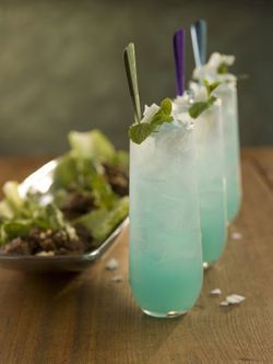 Blue Coco Mojo: blue curaçao, light rum, cocomint syrup, fresh lime juice, seltzer water, fresh mint Mint Syrup Recipe, July Cocktails, Wedding Signature Drinks, Munnar, Milk Shakes, Blue Curacao, Wedding Drink, Syrup Recipe, Bacardi