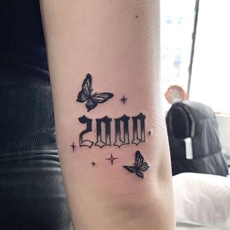 Birth Year Tattoo With Butterfly, Butterfly With Year Tattoos, 2005 Butterfly Tattoo, Birth Year Tattoo Ideas Ankle With Butterfly, Year Tattoo Number With Butterfly, Butterfly And Year Tattoo, 2000 Knee Tattoo, 1998 Tattoo Above Knee, 2000s Sleeve Tattoo