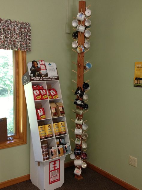 Floor to ceiling mug rack and Equal Exchange coffee display (pic by me at Bethlehem LC, Sturbridge, MA) Coffee Cup Display, Coffee Mug Storage, Basement Colors, Cup Display, Coffee Display, Coffee Cups Diy, Coffee Mug Display, Mug Storage, Tea Display