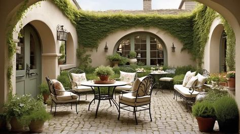 Spanish Patio Furniture, Spanish Colonial Courtyard, Spanish Courtyard Ideas, Spanish Style Patio Outdoor Spaces, Mediterranean Patios, Cobblestone Flooring, Spanish Style Patio, Spanish Style Courtyard, Spanish Patio