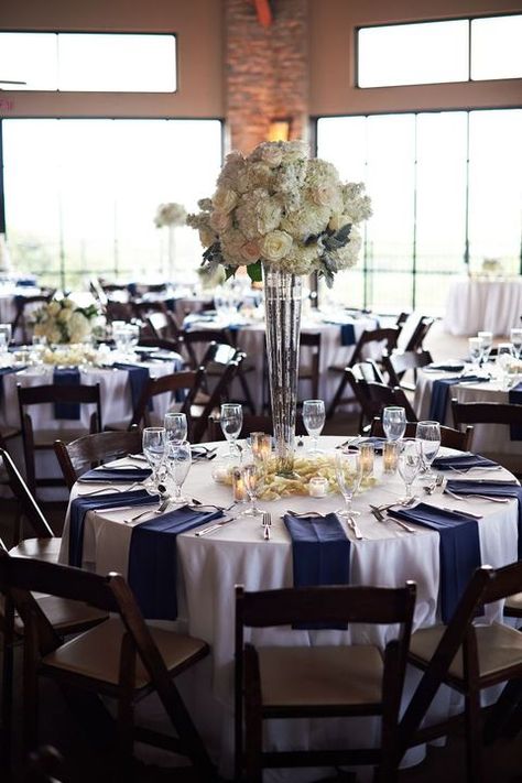 45 Gorgeous Navy And Silver Wedding Ideas | HappyWedd.com White Table Cloth With Navy Blue Napkins, Blue Silver Table Setting, Reception Set Up Layout Round Tables, Navy Table Centerpieces, White Linen Tablecloth Wedding, Navy And White Centerpieces, Navy Blue And White Table Setting, Napkin Setting, Grey Winter Wedding