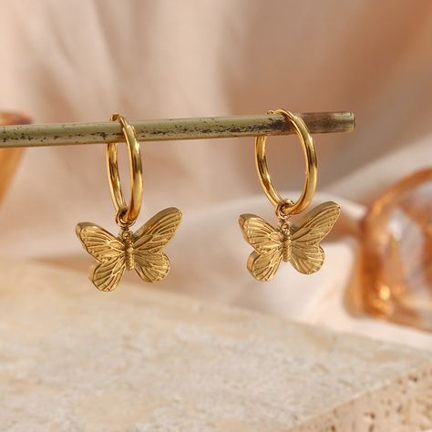 ✨ Butterflies and golden vibes! 🦋💖 Rocking these vintage gold huggies that are not only stunning but also waterproof! Perfect for any adventure. Shop now at aquagirl.co🔗Link in bio! #VintageStyle #GoldJewelry #ButterflyLove #WaterproofFashion Gold Aesthetic Earrings, Butterfly Jwellary, Butterfly Gold Earrings, Gold Butterfly Jewelry, Earring Butterfly, Gold Butterfly Earrings, Dainty Butterfly, Butterfly Earrings Gold, Earrings Butterfly