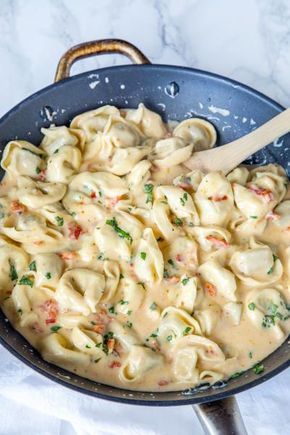 Creamy tomato basil tortellini makes a rich dinner the whole family will love. Pasta tossed in a sun-dried tomato cream sauce with plenty of fresh basil is where it’s at! Creamy Tomato Basil Tortellini, Tomato Basil Tortellini, Ham Pasta, Tomato Cream Sauce, Tortellini Recipes, Basil Pasta, Idee Pasto, Fettuccine Alfredo, Pan Meals