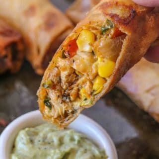 Cheesecake Factory Tex Mex Egg Rolls (Copycat) - Dinner, then Dessert Tex Mex Egg Rolls, Chicken Beans, Cheesecake Factory Recipes, Dinner Then Dessert, Crispy Egg, Creamy Avocado Sauce, The Cheesecake Factory, Spiced Chicken, Egg Roll Recipes