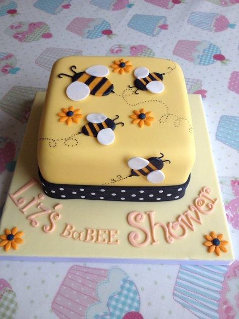 My client gave me a picture of what the theme for her sisters baby shower was and I created this cake to match it. I loved making the polka dot ribbon around the bottom. Bee Baby Shower Ideas, Rodjendanske Torte, Bee Cakes, Mommy To Bee, Bumble Bee Baby Shower, Bee Baby, Baby Cakes, Bee Baby Shower, Novelty Cakes