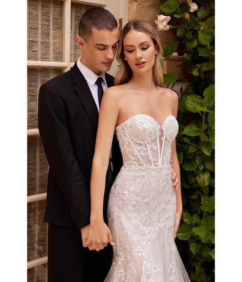 This stunning strapless beaded mermaid wedding dress is the perfect blend of elegance and seduction, featuring all the elements you need to make an unforgettable statement on your special day. The mermaid silhouette will flatter your figure with a layered tulle skirt cascading gracefully to the floor. The sheer boned bodice and deep plunging sweetheart neckline show off just the right amount of skin, all while highlighting those eye-catching beaded and sequin embellished details. Whether you're White Long Dress Formal, Corset Mermaid Wedding Dress, Beaded Mermaid Wedding Dress, White Strapless Wedding Dress, Strapless Wedding Dress Mermaid, Strapless Wedding Gown, White Evening Gowns, Beaded Mermaid, Cinderella Divine