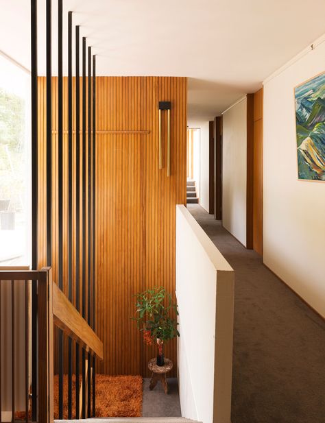 Inside a mid-century masterpiece in Remuera that's stood the test of time Mid Century Millwork, Mid Century Skirting Boards, Midcentury Trim Interior, Mid Century Wood Flooring, Wood Paneling Stairs, Mid Century Wainscoting, Mid Century Internal Doors, Mid Century Trim, Mid Century Modern Baseboards And Trim