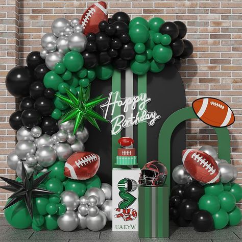 PRICES MAY VARY. PACKAGE INCLUDE: 46pcs dark green balloons,46pcs black balloons,45pcs metallic silver balloons,2pcs starburst foil balloons,3pcs football foil balloons,1pcs balloon arch strip tape,1 roll of 100 dot glue. PREMIUM MATERIAL: Our party balloons are made of natural latex, non-toxic. All materials are of high quality and good safety. WIDELY APPLICATIONS: The balloon arch kit is perfect for birthday party,baby shower,football themed party,sports themed party,touch down 1st party decor Eagles Football Birthday Party, Sports Themed Balloon Arch, Boston Celtics Birthday Party Ideas, Jersey Party Theme, Football Balloon Arch, American Football Birthday, Football Themed Birthday Party, Nfl Party, Football Balloons