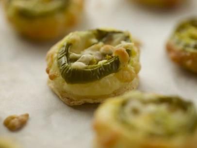 Cowboy Cheese Bites Recipe | Ree Drummond | Food Network Puff Pastry Cheese, Using Puff Pastry, Cheese Bites Recipe, Ree Drummond Recipes, Bar Snacks, Blue Cheese Sauce, Snack Bites, Boarding House, Pioneer Woman Recipes