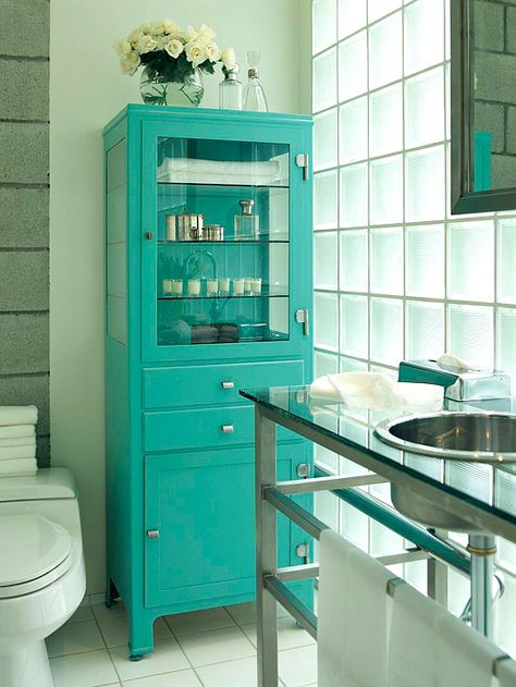 An old-fashioned pharmacy cabinet with a fresh coat of fun paint offers glass-front display and makes for great bathroom storage Teal Bathroom, Bad Inspiration, Bathroom Cabinet, Beautiful Bathrooms, Bathroom Inspiration, Bathroom Storage, My Dream Home, Modern Bathroom, Small Bathroom