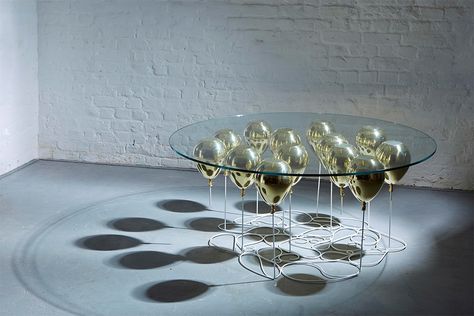 gold-table-2 Floating Table, Floating Balloons, Unique Desks, Up Balloons, Contemporary Furniture Design, Table Cafe, Retail Design Blog, Gold Table, Glass Top Table