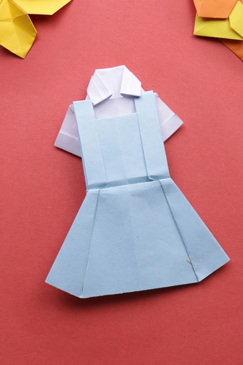 Today we will make this cute little MINI SCHOOL BAG / BACKPACK.  Please SUBSCRIBE to our channel, we'll be posting more videos soon.  #origami #dress #uniform #arts #crafts #decorations #diy #artandcrafts #papermade #doityourself #paperfolding #origamieasy School Dress Uniform, Mini School Bag, Paper Easter Basket, Paper Ninja Stars, Origami Elephant, Origami Dress, Origami Videos, Crafts Origami, Origami Fish