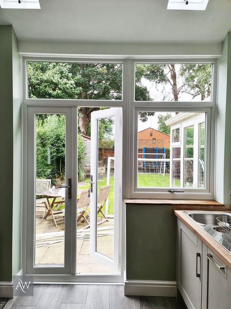 Outswing French Doors With Screens, Glass Door With Windows On Side, Window Next To French Doors, Back Door And Window Ideas, Kitchen French Windows, Kitchen With Side Window, Small Kitchen With French Doors To Patio, Kitchen Door Exterior, Doors In Kitchen To Outside