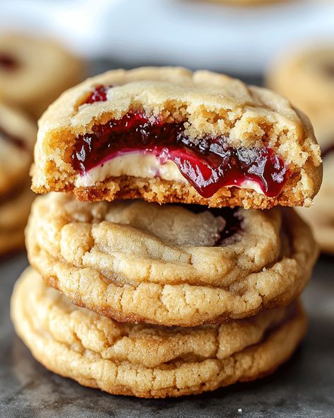 Cherry Cheesecake Stuffed Cookies – a delightful treat combining creamy cheesecake and tangy cherry filling for a gooey, irresistible dessert! Cheesecake Filling Cookies, Cranberry Cheesecake Cookies, Cherry Pie Filling Cookies, Cheesecake Filling For Cookies, Cherry Pie Stuffed Cookies, Strawberry Cheesecake Stuffed Cookies, Cherry Cheesecake Cookies, Cheesecake Stuffed Cookies, Cookies Gooey