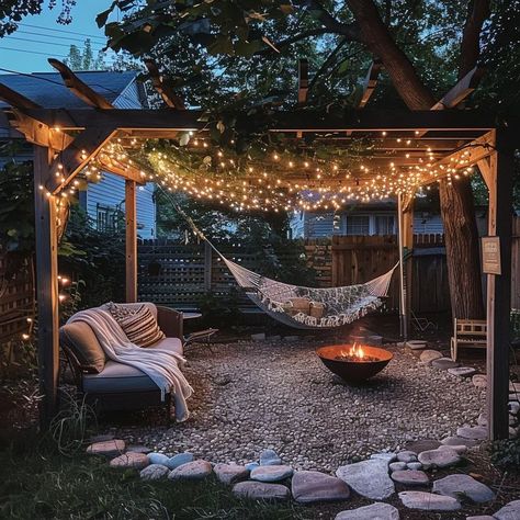 Serene backyard oasis with pergola, hammock, and fire pit surrounded by lush greenery Backyard Landscaping Hammock, Backyard Hammock Oasis, Backyard With Hammock, Hammock Pergola, Pergola Hammock, Cozy Outdoor Spaces, Serene Backyard, Cozy Hammock, Cottage Backyard