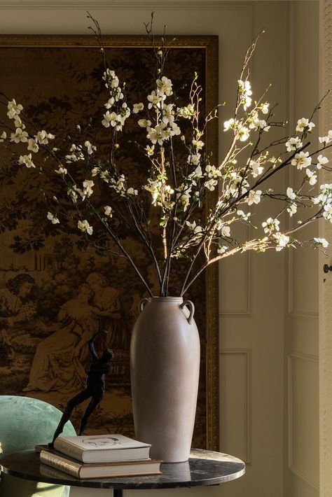 large faux blossom branches in Afloral vase Tall Artificial Floral Arrangements, Quince Blossom, Branches In A Vase, Tall Flower Arrangements, Tall Flower Vase, Branch Centerpieces, Vase With Handles, Flower Branches, Wedding Altar