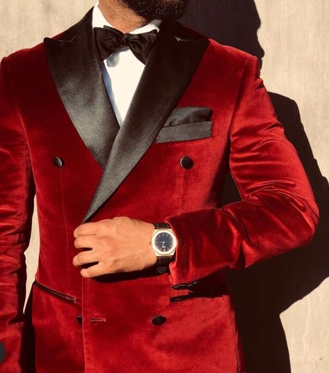 This red velvet tuxedo jacket offers a prestigious look for your groom attire. It is a wonderful mens outfit for those with a red and black wedding theme color schemes. If you want this red tux made custom for you, book an appointment with us at Giorgenti! #weddingoutfit #wedding #groomsuit #groomtuxedo Red And Black Tuxedo Men, Groom Red Suit Wedding, Red Velvet Tuxedo Men, Black And Red Tuxedo Wedding Groom Suits, Red And Gold Groomsmen Attire, White And Red Groom Suit, Red Velvet Groom Suit, Black And Red Suit For Men Wedding, Red Grooms Suit