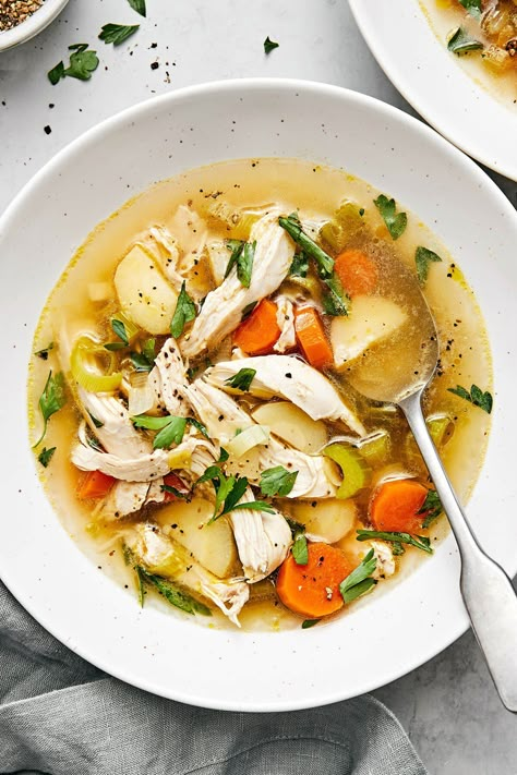 This is the best homemade chicken soup recipe loaded with poached chicken, hearty winter vegetables, and fresh herbs. Hearty Chicken Noodle Soup, Downshiftology Recipes, Turmeric Milk Recipe, Easy Chicken Stew, Soup Recipes Homemade, Best Chicken Soup Recipe, Chicken Soup Recipes Homemade, Cozy Soups, Homemade Chicken Soup